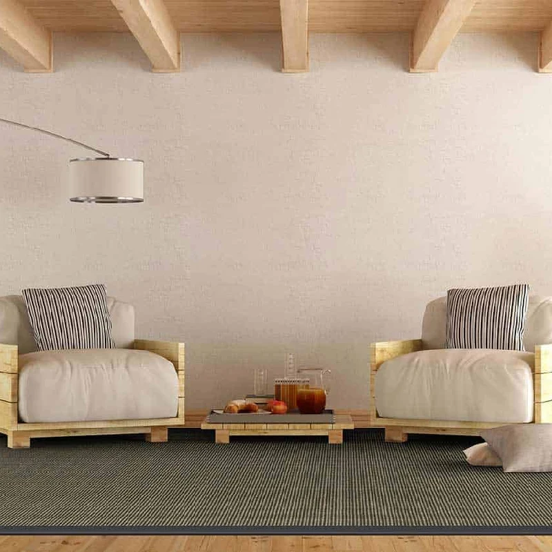 Short-pile, dark-colored carpet with a ribbed or striped pattern.