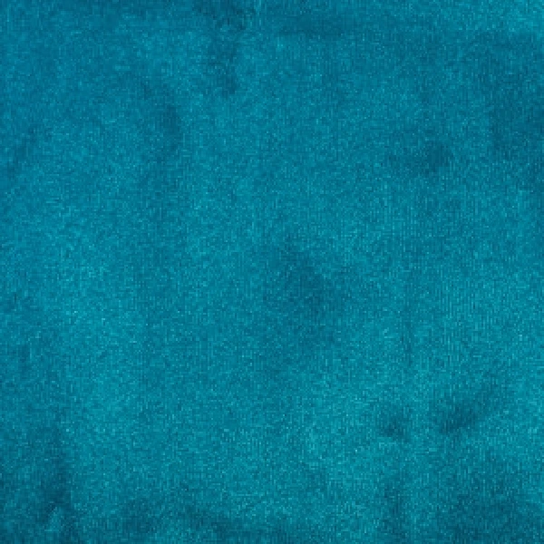 Teal-colored plush carpet texture.
