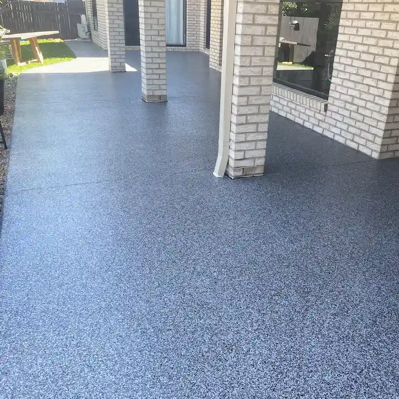 Gray speckled stone carpet flooring on an outdoor