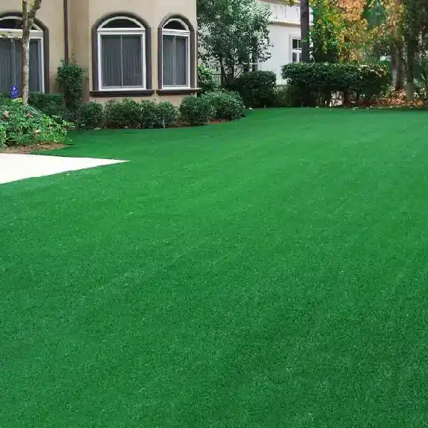 emerald-green, uniformly manicured artificial grass carpet