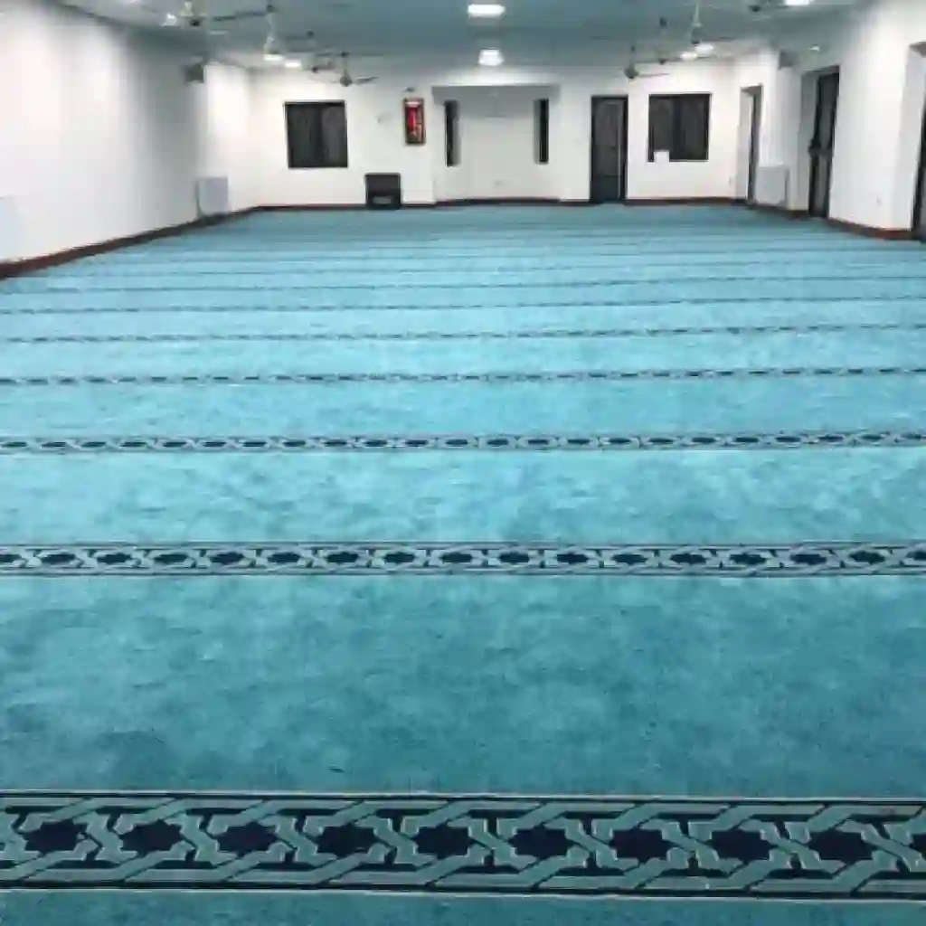 Mosque Carpet 27 light blue mosque carpet with parallel dark patterned lines