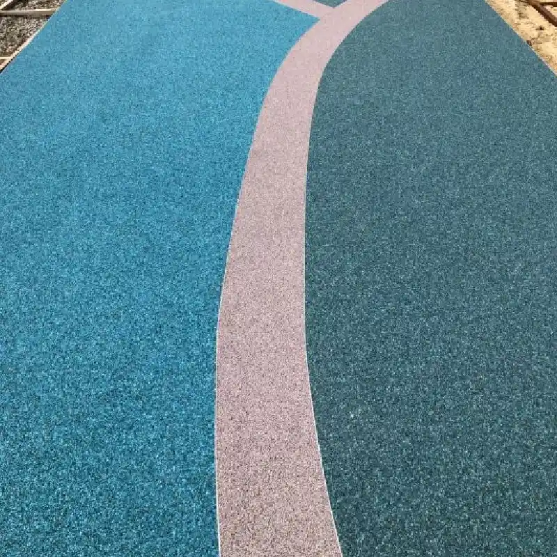stone carpet with a curving beige stripe separating bright blue and dark green sections
